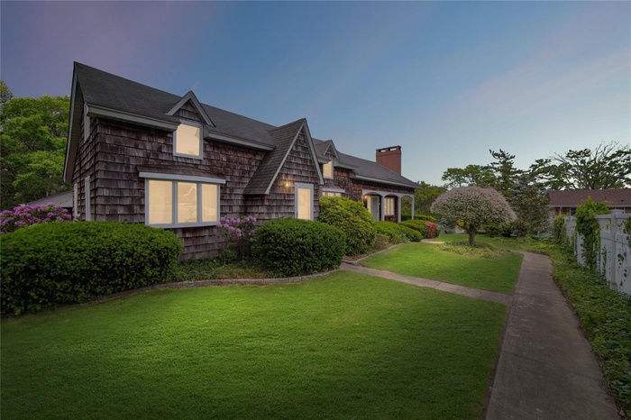 View of home's exterior with a chimney