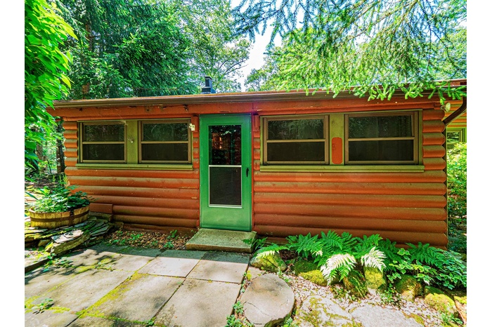 View of front of house with log exterior