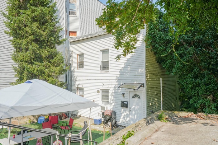 Rear view of property with a patio area