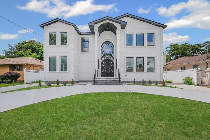 View of front of house featuring stucco siding