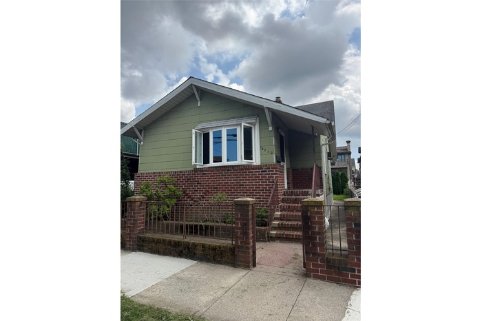 View of front of house with brick siding