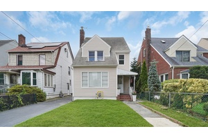 Welcome to 241 10 86th Avenue a beautifully renovated home located on a quiet, tree lined block in the heart of Bellerose.
