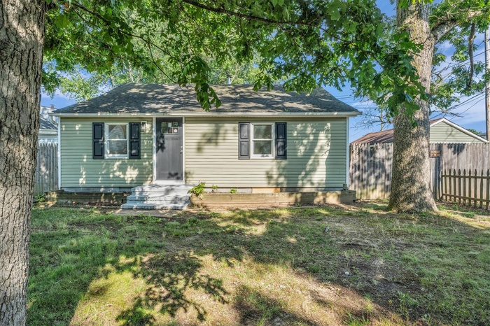View of front of property with roof with shingles