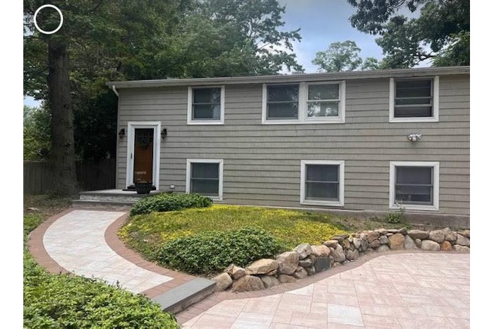 View of front of house with a patio