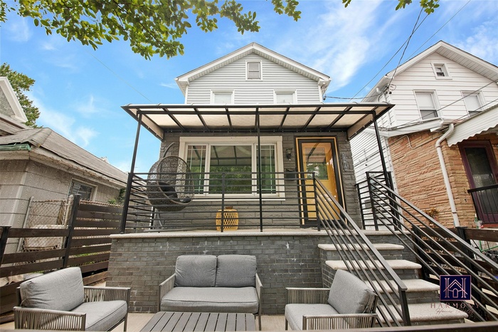 Back of property with outdoor lounge area