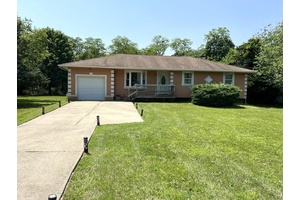 Nestled in the heart of Bellport, this delightful Ranch home boasts a sprawling yard just shy of a half acre perfect for outdoor entertaining, gardening, play, and relaxation.