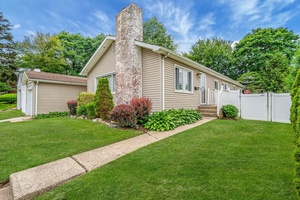 Set on a quiet block, this expanded ranch offers a surprising amount of space inside and out.