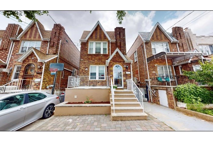 View of front of house featuring brick siding