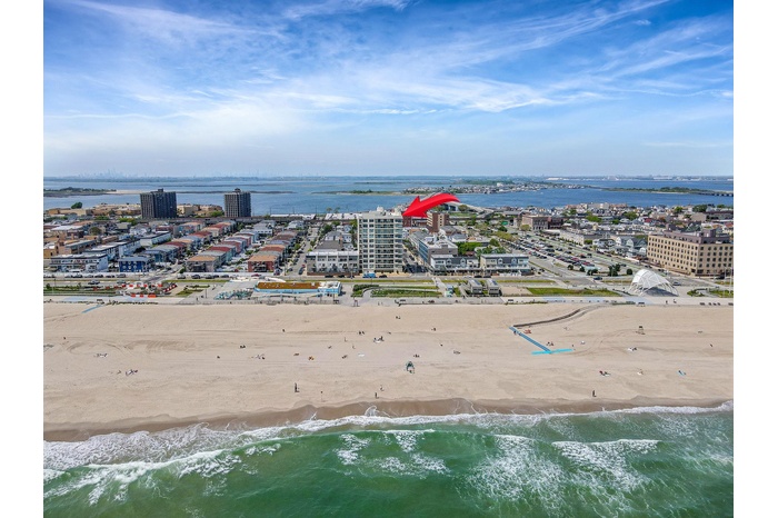 Bird's eye view featuring a beach view, a view of city, and a water view