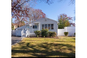 Welcome to 1255 Udall Road in Bay Shore a stylish and move in ready 3 bedroom, 1.