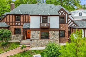 North Flushing Tudor style mansion plus an independent 300 plus square foot office or studio with a full bathroom.