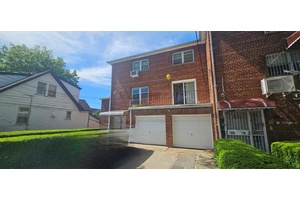 Welcome to this stunning semi attached brick colonial, a rare legal three family gem nestled on a quiet, tree lined street in a sought after Queens neighborhood.