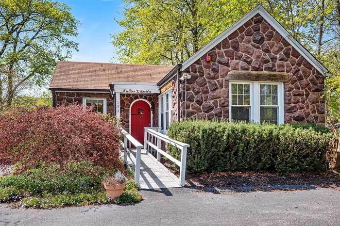 View of front of home with stone siding