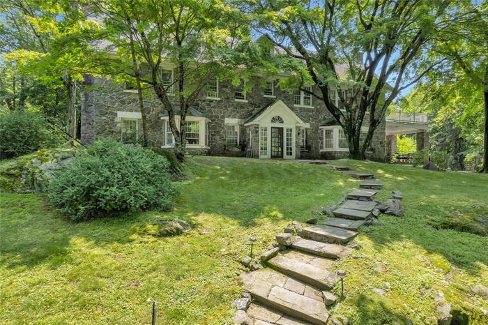 View of green lawn with french doors