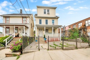 Discover this versatile and inviting two family residence situated just minutes from the vibrant New Roc City Center.