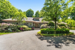 Welcome to a meticulously maintained, architecturally striking contemporary residence nestled in one of Harrison s most sought after neighborhoods.