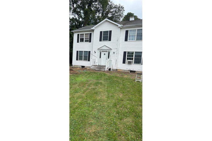Colonial with generous landing/porch.