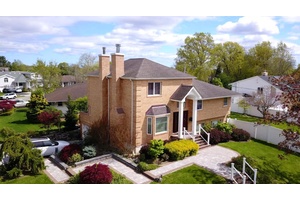 Welcome to this stunning 5 bedroom, 4 bathroom corner huge brick split level home, spacious primary suite on the second level, and the second master room in the upstairs allowing ...