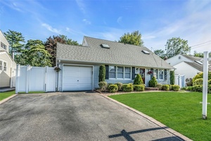 This expanded Cape, situated mid block on a flat, professionally landscaped lot, offers a perfect blend of comfort and easy living.