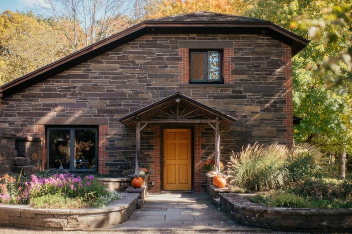 View of front of house with stone siding