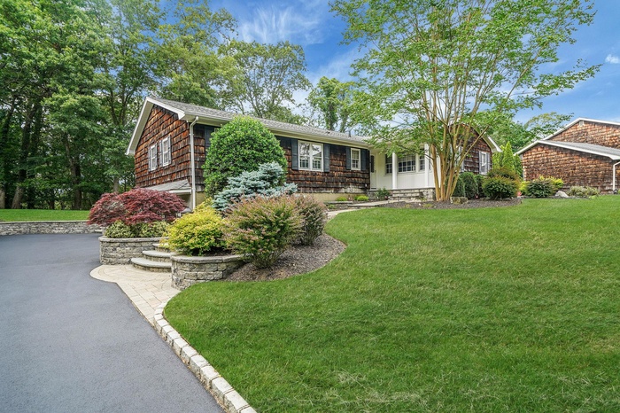 View of front of house with a front lawn