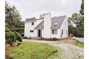 Welcome to 14 Caputo Drive in Manorville, NY, a beautifully remodeled contemporary home that s truly move in ready and simply stunning.