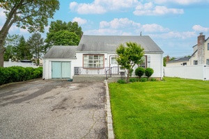 This Home Features Hardwood Flooring, 5Large Rooms, and 3 Full Bathrooms.