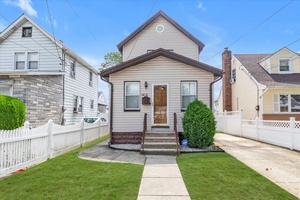 Impeccably Maintained Home on A Beautiful Residential Block.