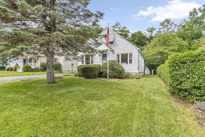 View of front of property with a front yard