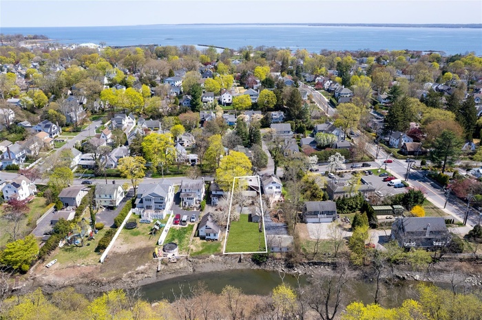 Bird's eye view with a residential view and a water view