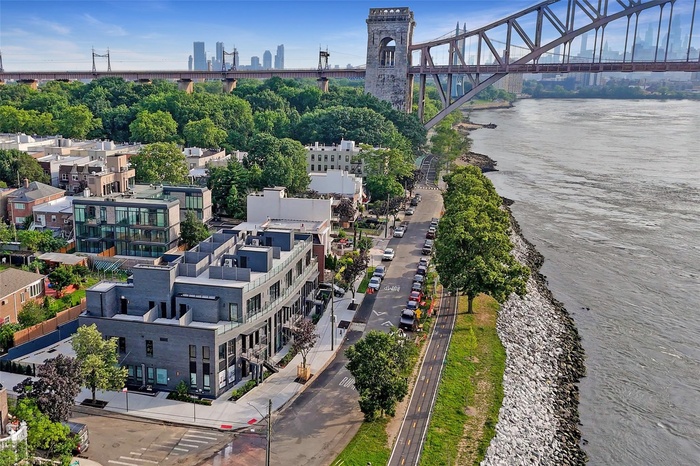 Aerial view of a notable bridge and a large body of water