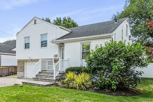 Welcome to this waterfront 4 bedroom, 2 bath split level home nestled in the heart of Cedarhurst.