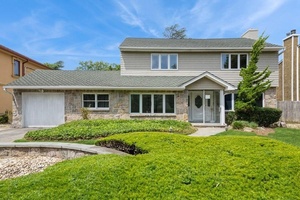 Charming Center Hall Colonial located on a highly desirable street !