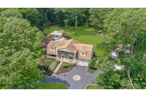 Welcome to 15 Stillwood Road, a stately Colonial nestled in the heart of Brookhaven Hamlet.