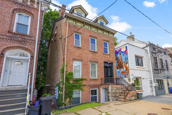 Italianate home with brick siding
