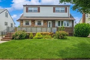 Cozy 2 Family Set Mid Block in Quiet Residential Neighborhood in the Village of Valley Stream.