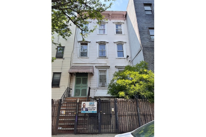 View of front of property with a fenced front yard