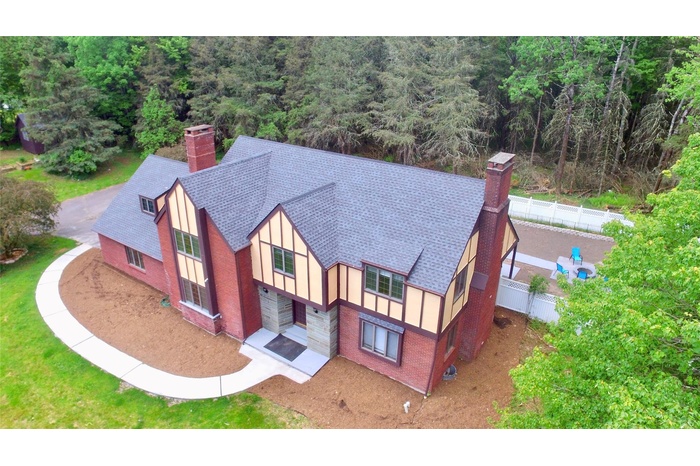 View of subject property with a forest