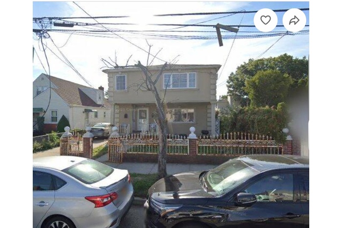 View of front of house featuring a fenced front yard and stucco siding