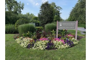 Lovely Madison one level end unit in the desirable Heritage Hills community !