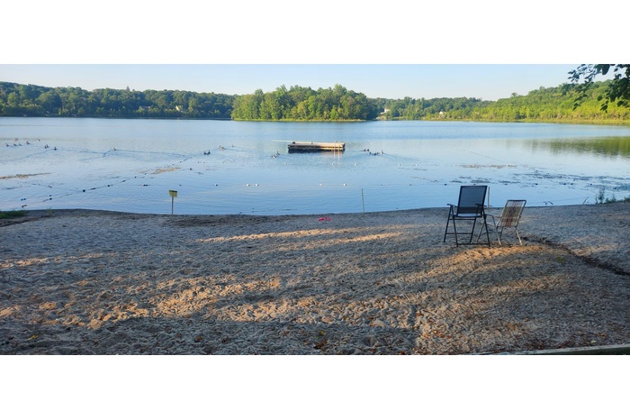Water view featuring a heavily wooded area