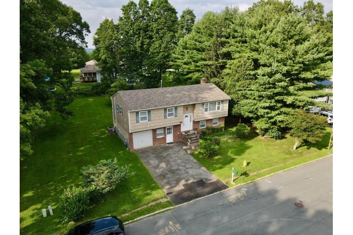 View of front of the property with the sideyard.