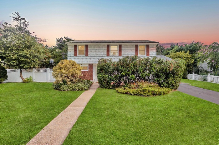 View of front of property featuring brick siding