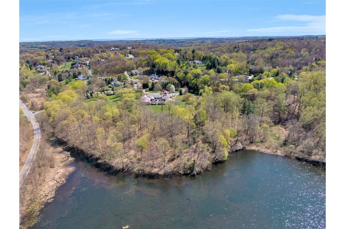 Aerial view featuring view of the lake! Existing structure is uninhabitable and must be removed!