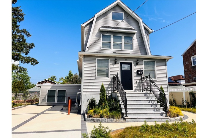 Dutch colonial featuring a gambrel roof and a patio area
