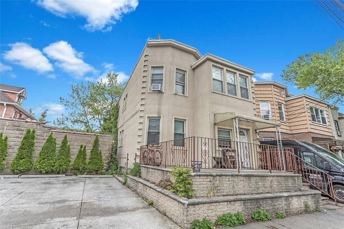 View of property with stucco siding