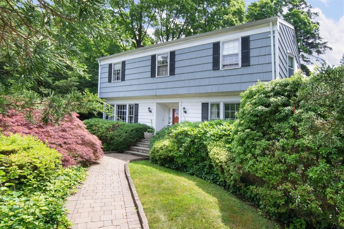 Welcome to this charming Colonial nestled in the highly sought-after "Little Farms" neighborhood of White Plains!