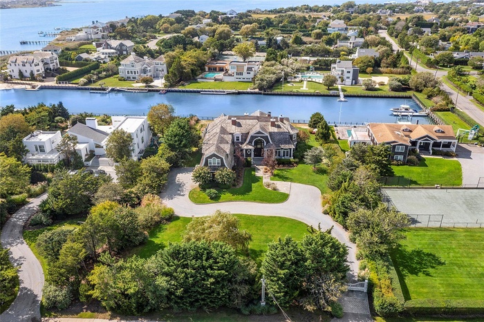Drone / aerial view featuring a water view and a residential view