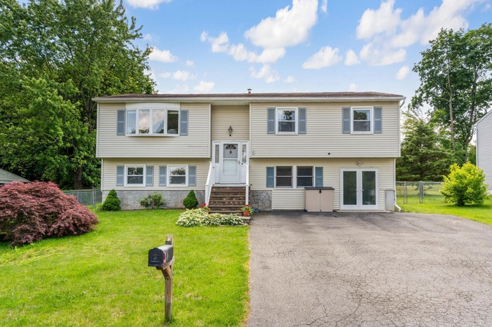 Bi-level home featuring driveway
