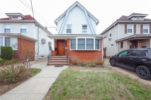This detached two family home, situated on a 32x100 lot in the Madison neighborhood, offers a spacious layout and extensive modern upgrades.